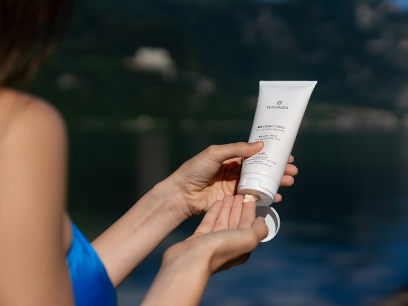 Applying sunscreen outdoors